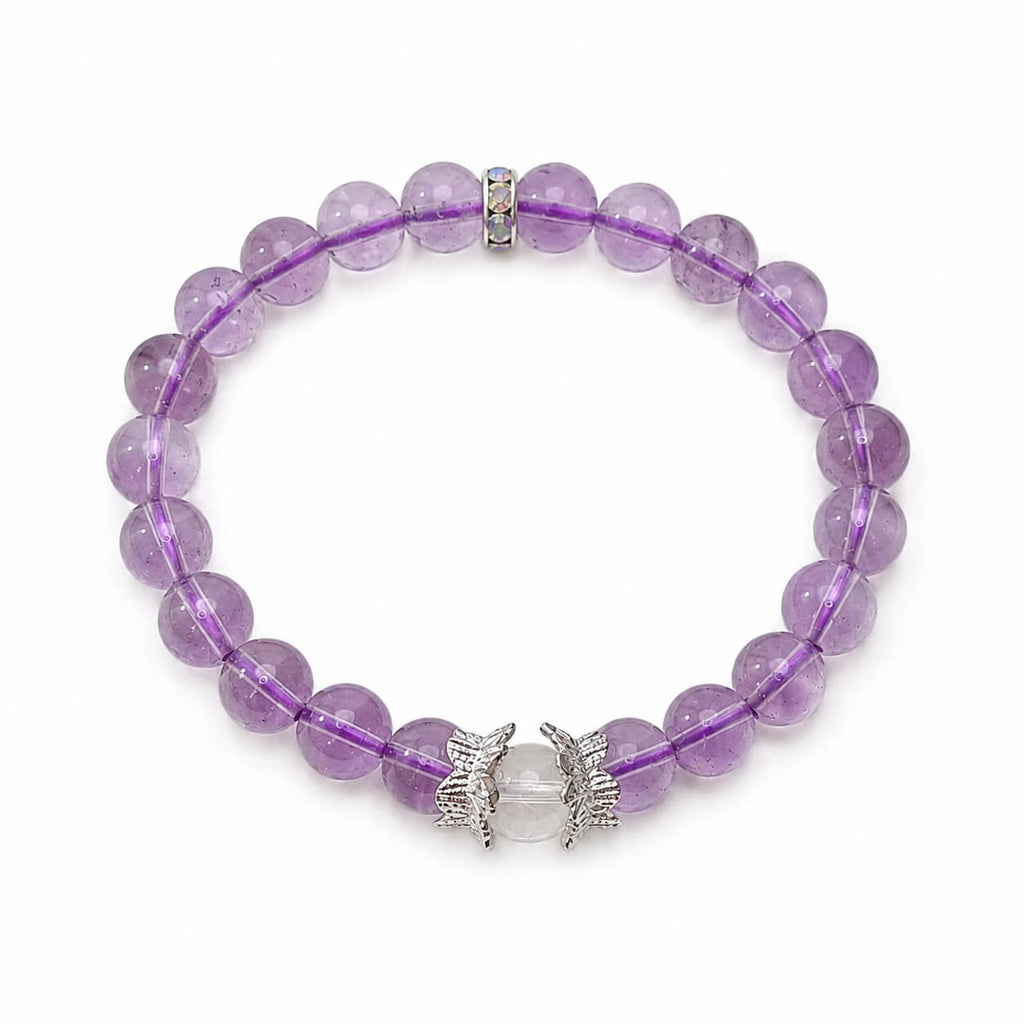 AURA Amulet amethyst crystal bracelet with clear quartz laid flat for a clean product showcase.
