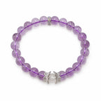 AURA Amulet amethyst crystal bracelet with clear quartz laid flat for a clean product showcase.