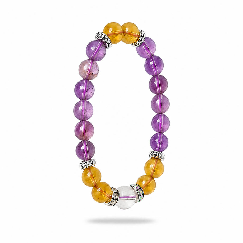 Stress relieving amethyst and citrine crystal bracelet elegantly angled on a white background to highlight beads.