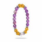 Stress relieving amethyst and citrine crystal bracelet elegantly angled on a white background to highlight beads.