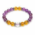 Natural amethyst and citrine crystal bracelet laid flat on a clean white background for a minimalist showcase.