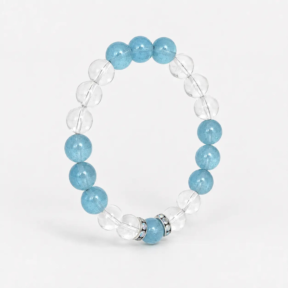 Aquamarine and clear quartz crystal bracelet shown upright at a 45 degree angl