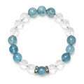 Aquamarine crystal bracelet with clear quartz beads in a round white background flat lay