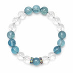Aquamarine crystal bracelet with clear quartz beads in a round white background flat lay