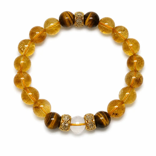 AURA Amulet citrine bracelet featuring tiger stone energy and clear quartz laid flat on white. 