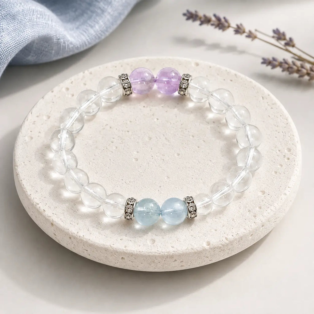 AURA Amulet Quiet Tides clear quartz bracelet with aquamarine and amethyst, a crystal for calm on stone with lavender.