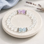 AURA Amulet Quiet Tides clear quartz bracelet with aquamarine and amethyst, a crystal for calm on stone with lavender.