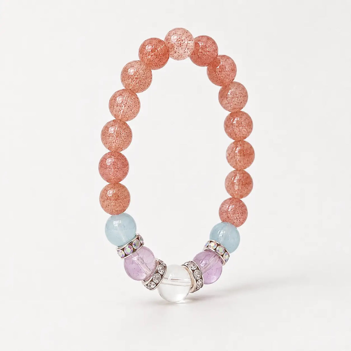 Upright strawberry quartz stretch bracelet showing the full circular bead arrangement