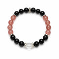 AURA Amulet protection bracelets for women with obsidian and strawberry quartz beads laid flat on white. 