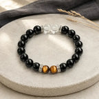 AURA Amulet black obsidian bracelet with tiger's eye and clear quartz, a negative energy protection bracelet on stone.
