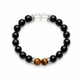 AURA Amulet obsidian bracelet for protection with tiger's eye and quartz beads, laid flat for product clarity.