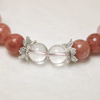 AURA Amulet close-up of handmade best friend bracelets with silver leaf beads and clear quartz.
