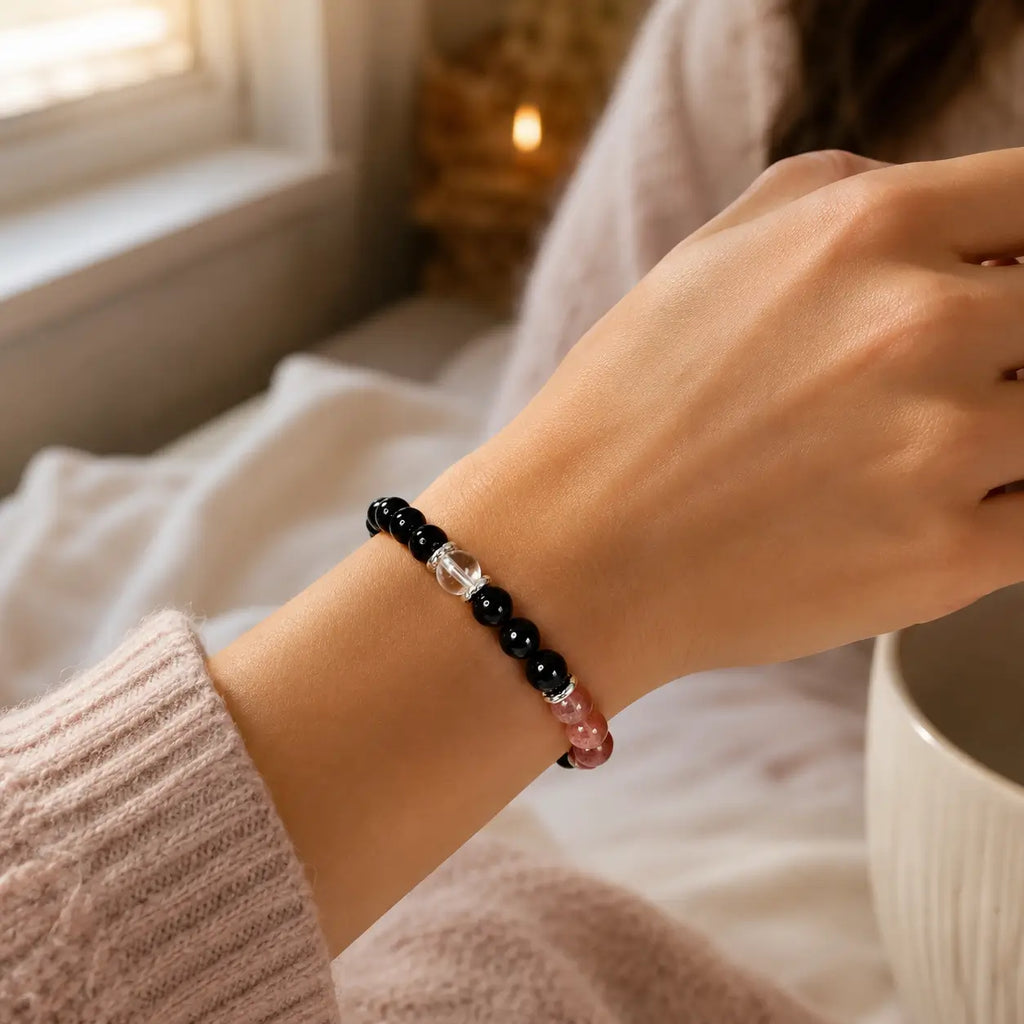 AURA Amulet spiritual bracelets for protection worn on wrist with soft sweater, offering daily energetic shield.